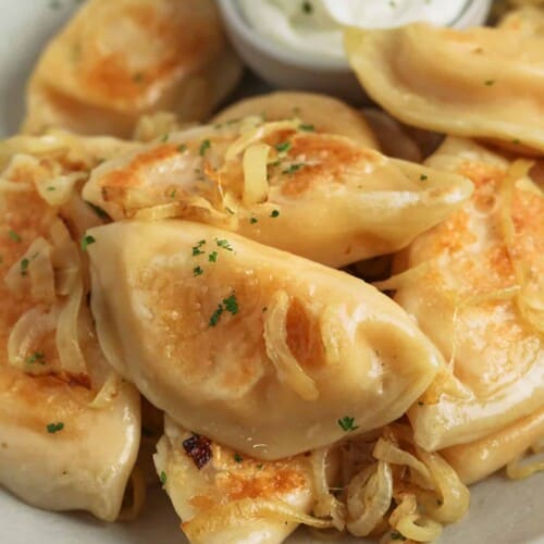 Pierogi with sour cream