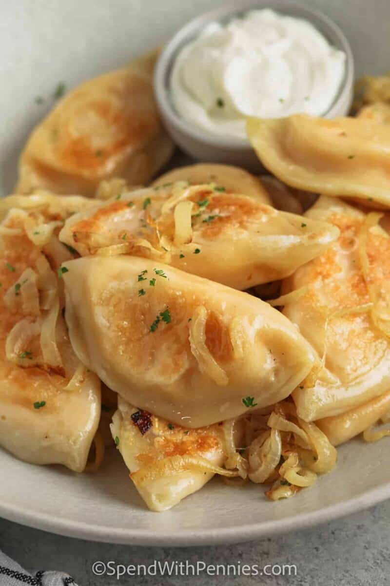 Pierogi with sour cream