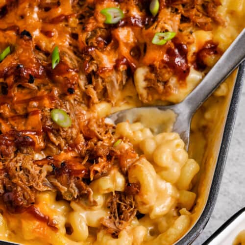 taking a spoonful of Pulled Pork Mac and Cheese