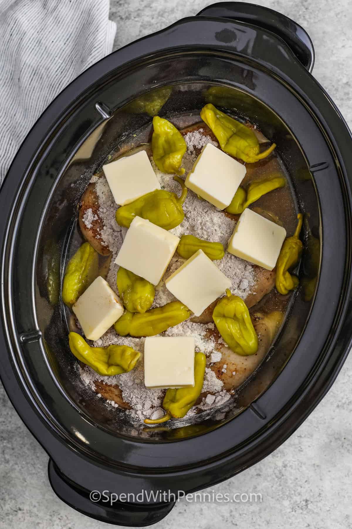 Crock Pot Mississippi Chicken ingredients in a slow cooker before being cooked