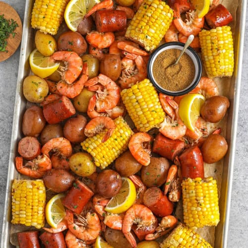 sheet pan of Shrimp Boil with seasoning