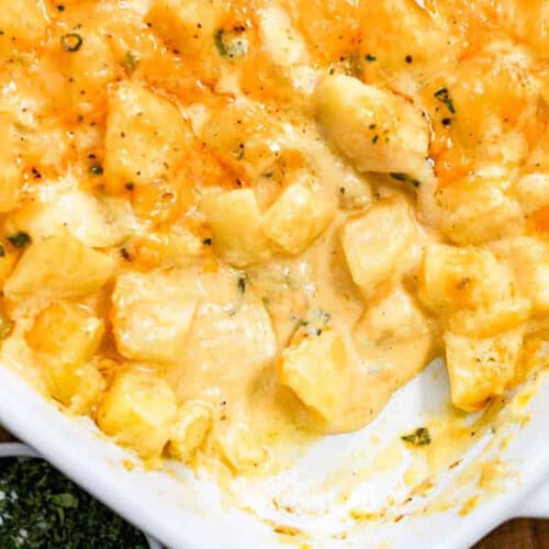 Easy Cheesy Potatoes in the pan with a portion taken out