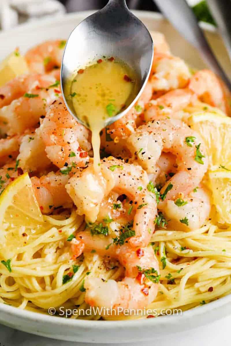 pouring garlic butter over Easy Shrimp Scampi Recipe