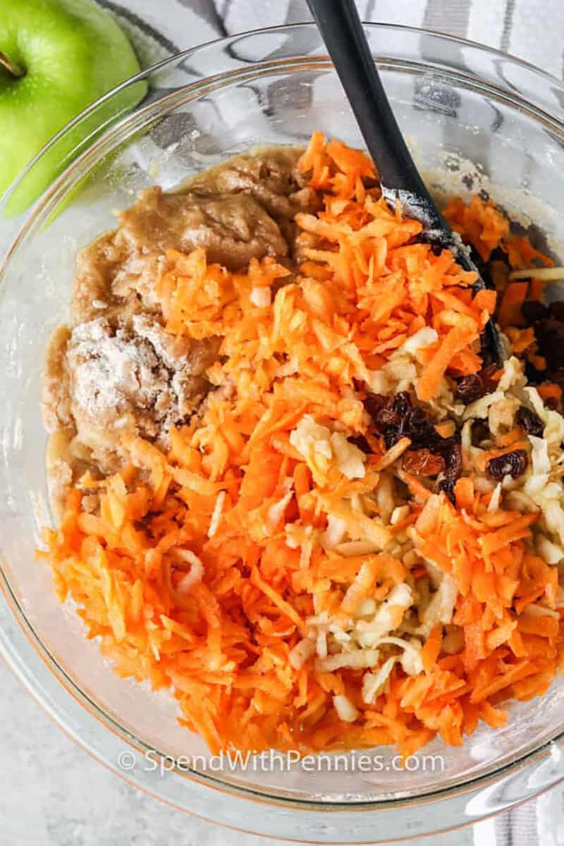 mixing Carrot Muffins ingredients in a bowl