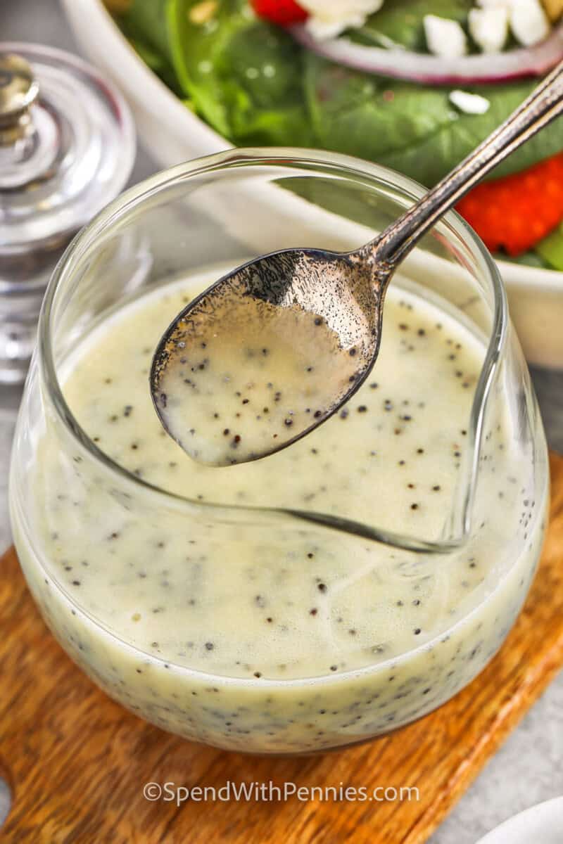 jar of Poppy Seed Dressing with a spoon