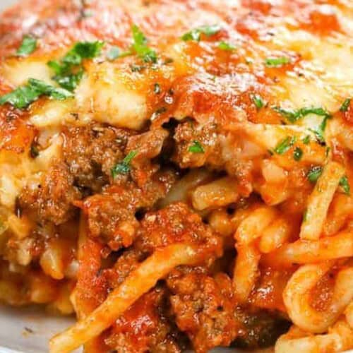 a close up of baked spaghetti on a plate