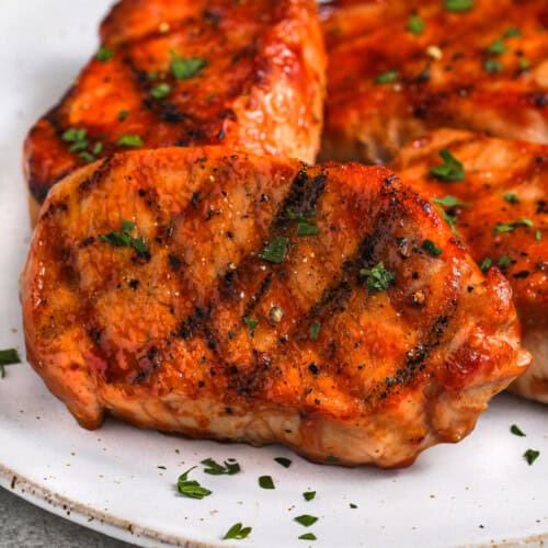 BBQ Pork Chops on a plate with garnish