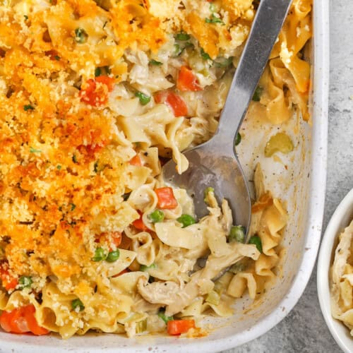 Chicken Noodle Casserole in the casserole dish with a spoon