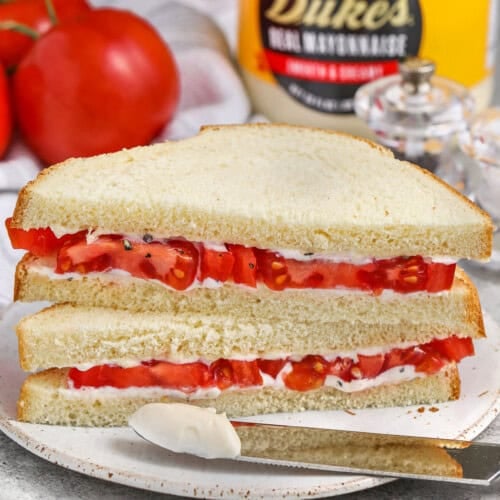 Classic Tomato Sandwich with mayonnaise on the sandwich and on a knife
