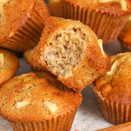 plate of cinnamon Apple Muffins with a bite taken out of one