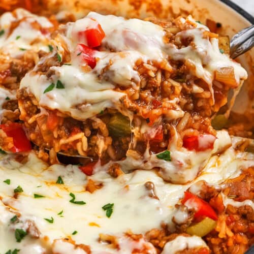 taking a spoonfull of Stuffed Pepper Casserole out of the pot