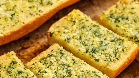 Homemade Garlic Bread cut into slices on a sheet pan