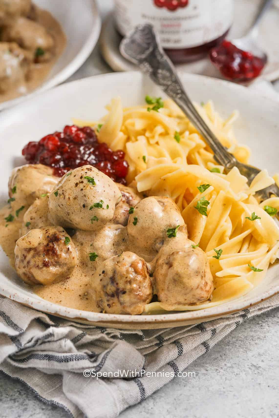 Swedish meatballs with egg noodles on a plate