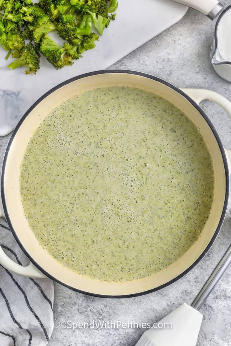 A pot of broccoli cheddar soup after blending.