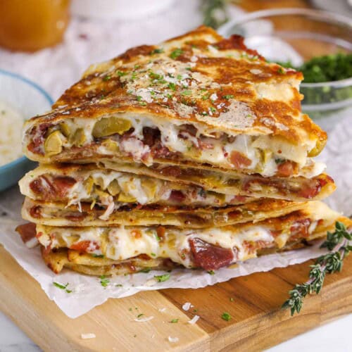 charcuterie quesadillas on a wood board