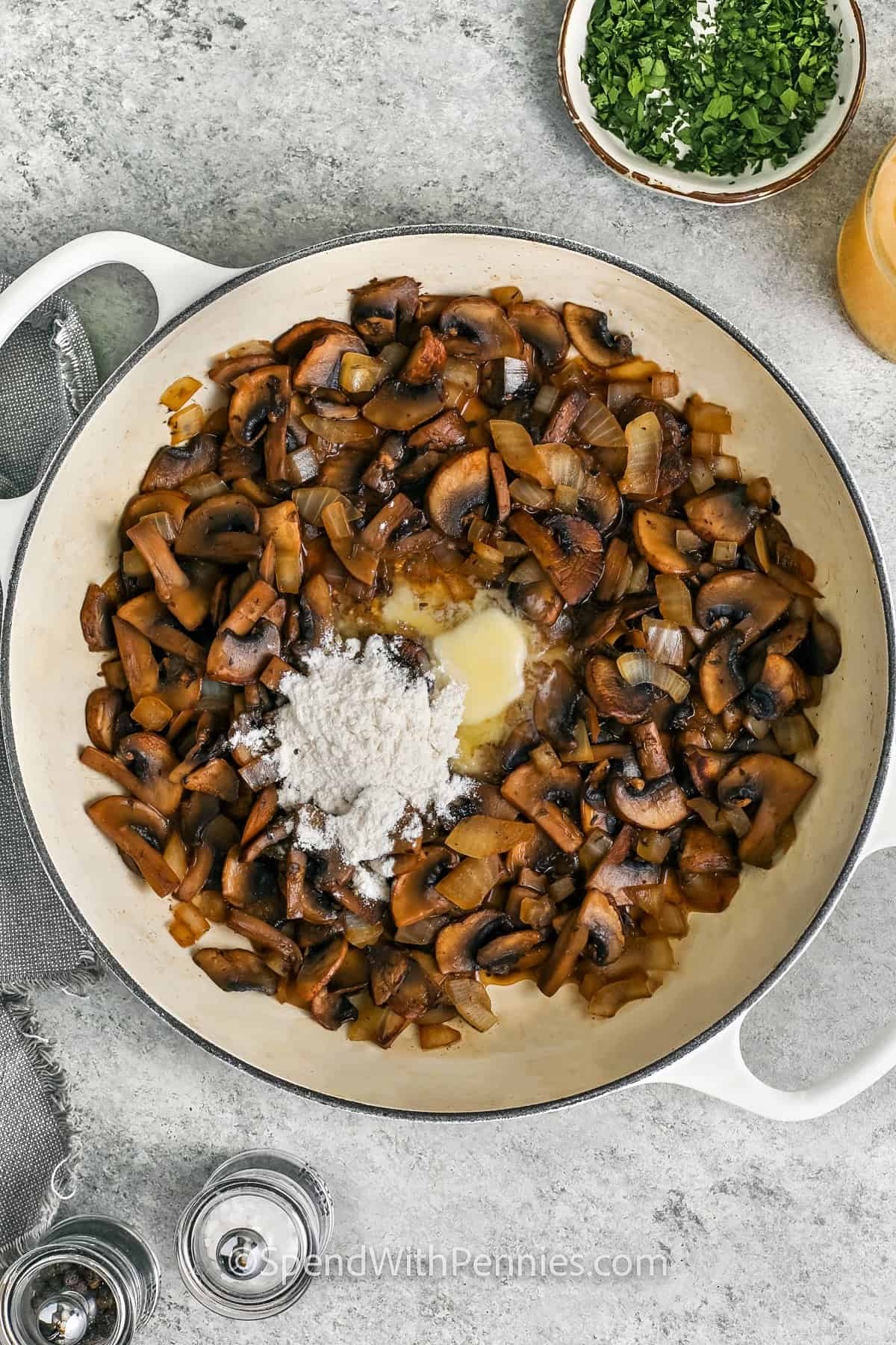 adding flour and butter to mushrooms to make gravy and show How to Cook Pork Tenderloin