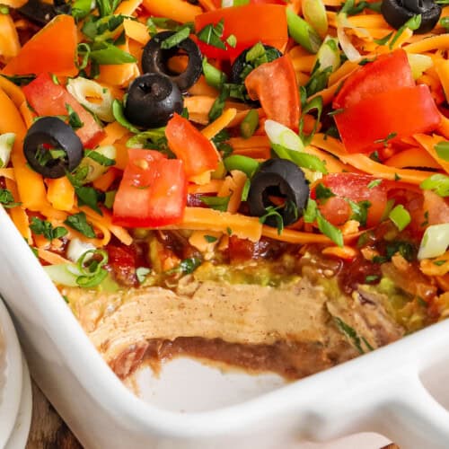 close up of 7 Layer Dip with a portion taken out