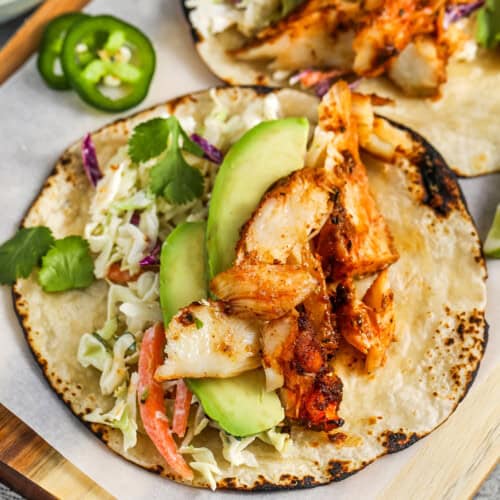 close up of Fish Tacos with avocado and cilantro