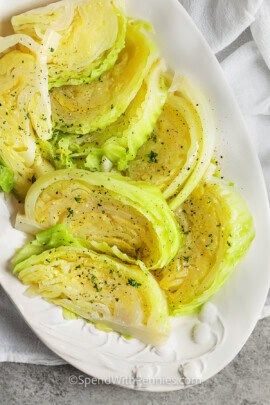 top view of wedges of boiled cabbage on a serving plate