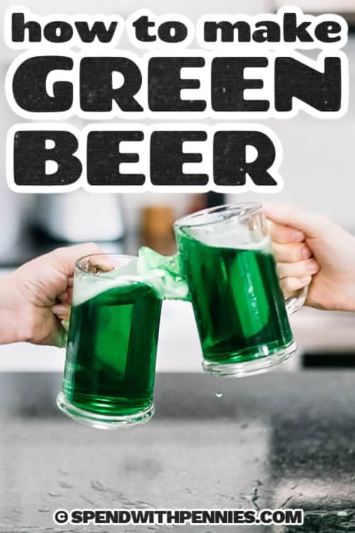 two hands toasting with pints of green beer for how to make green beer recipe, with writing