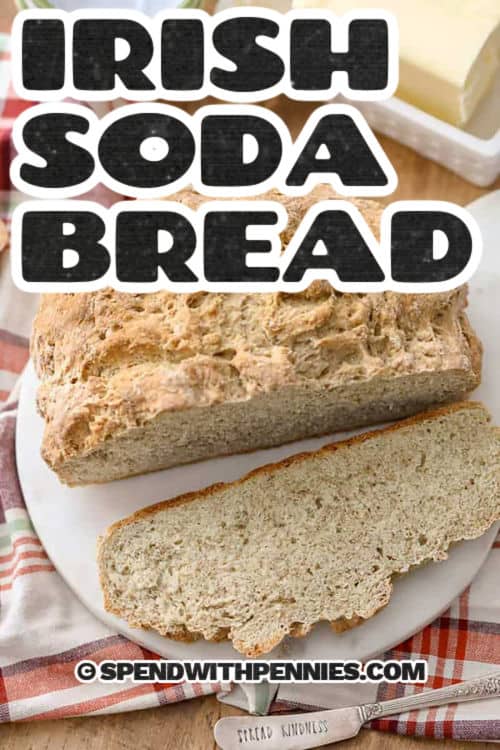 a cut loaf of Irish soda bread with writing