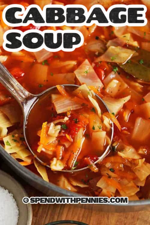 Delight in a bowl of goodness with this cabbage soup recipe! It's a classic recipe that's easy to whip up for a family favorite. Chopped cabbage and seasonings come together in a beefy tomato broth for a real crowd-pleaser. Add your own touch by incorporating proteins like ground beef, chicken, sausage, or tofu, or go meat-free. This comforting cabbage soup can be a side, a main dish, or a filling, low-carb starter. #spendwithpennies taking a spoonfull of Quick Cabbage Soup out of the pot with a title