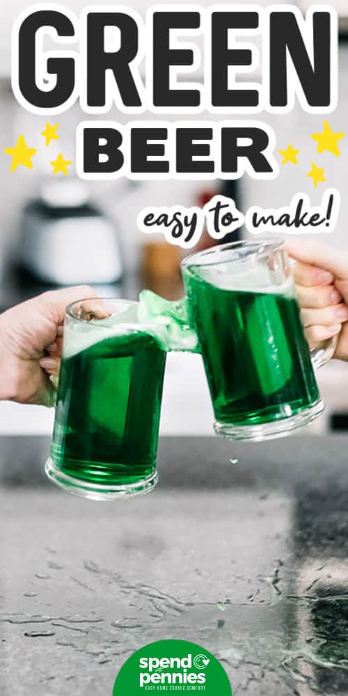 hands toasting while holding glasses of green beer, with writing, for how to make green beer recipe
