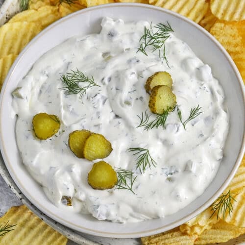 4 Ingredient Dill Pickle Dip in a bowl with pickle slices on top