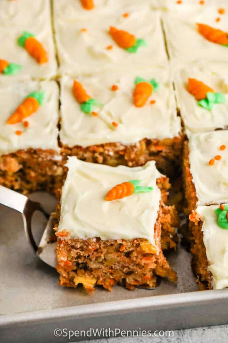 close up of taking a piece of Carrot Cake Recipe out of the pan