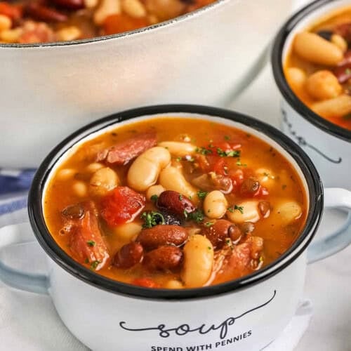 plated Ham and Bean Soup with pot full in the back