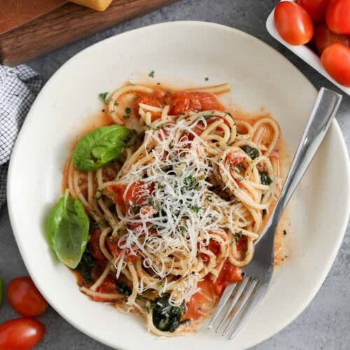 One Pot Spaghetti on a plate with parmesan cheese