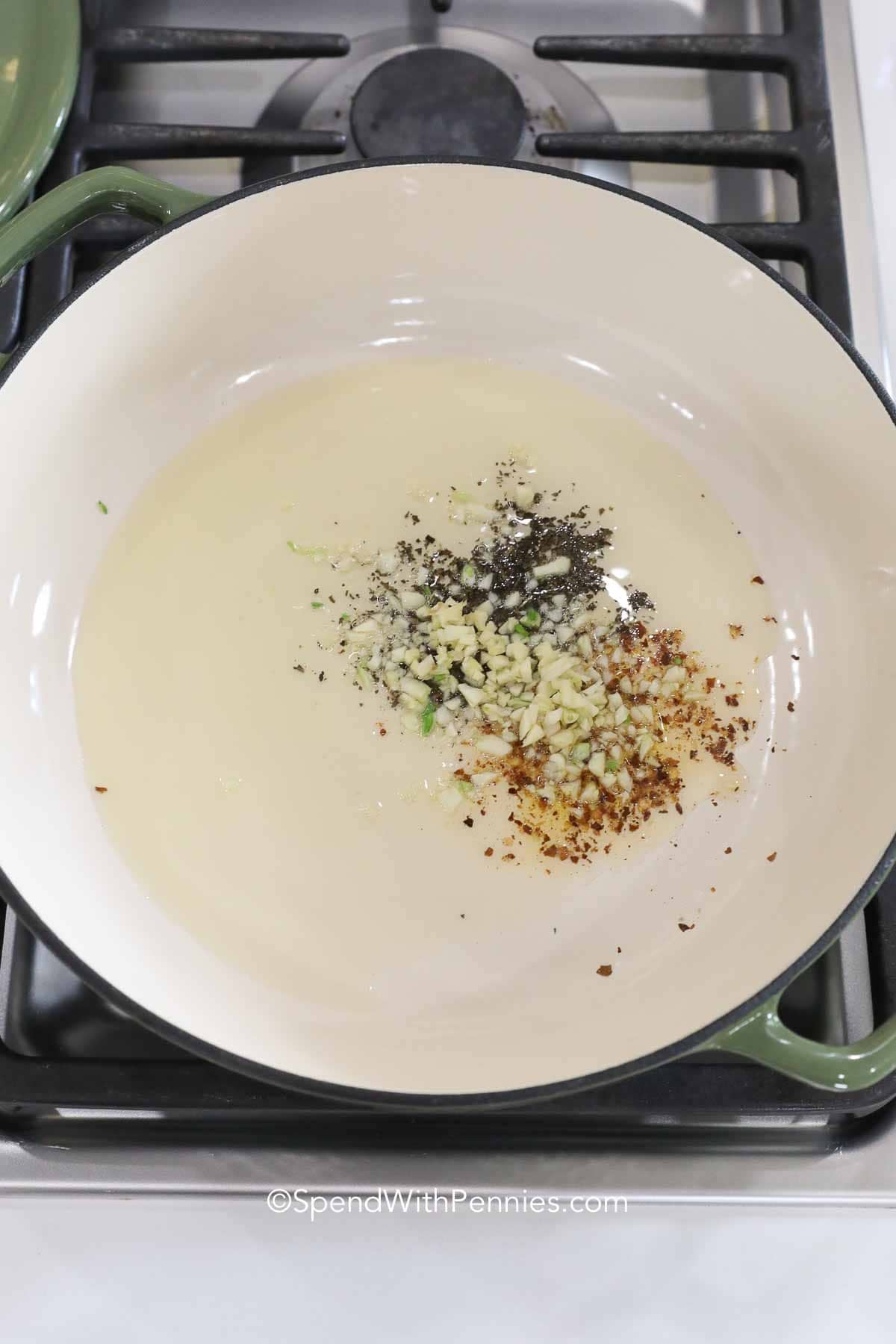 garlic and spices in a Dutch oven for One Pot Spaghetti