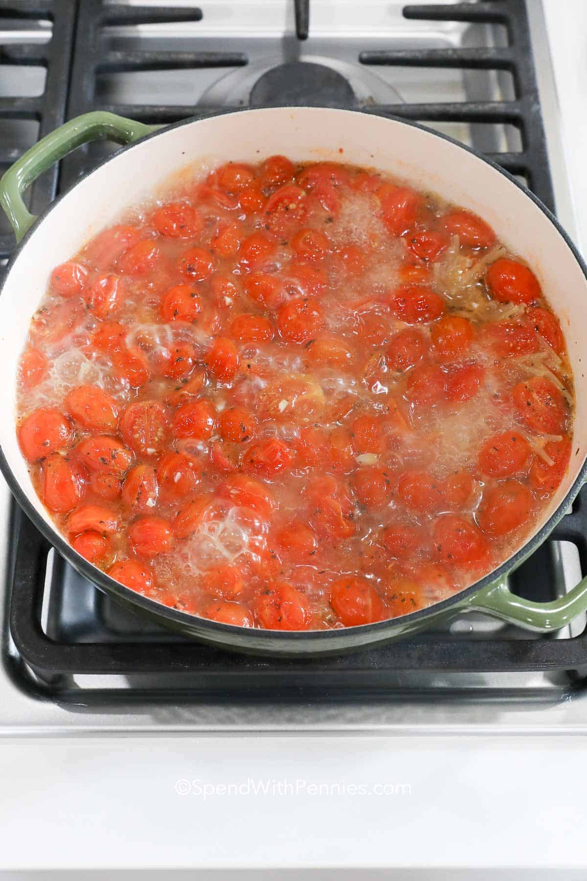 simmering tomatoes in a Dutch oven for One Pot Spaghetti