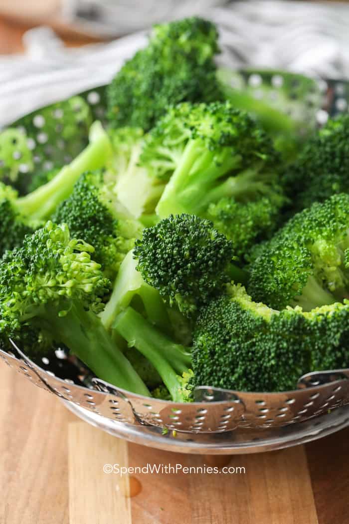 broccoli in strainer on board