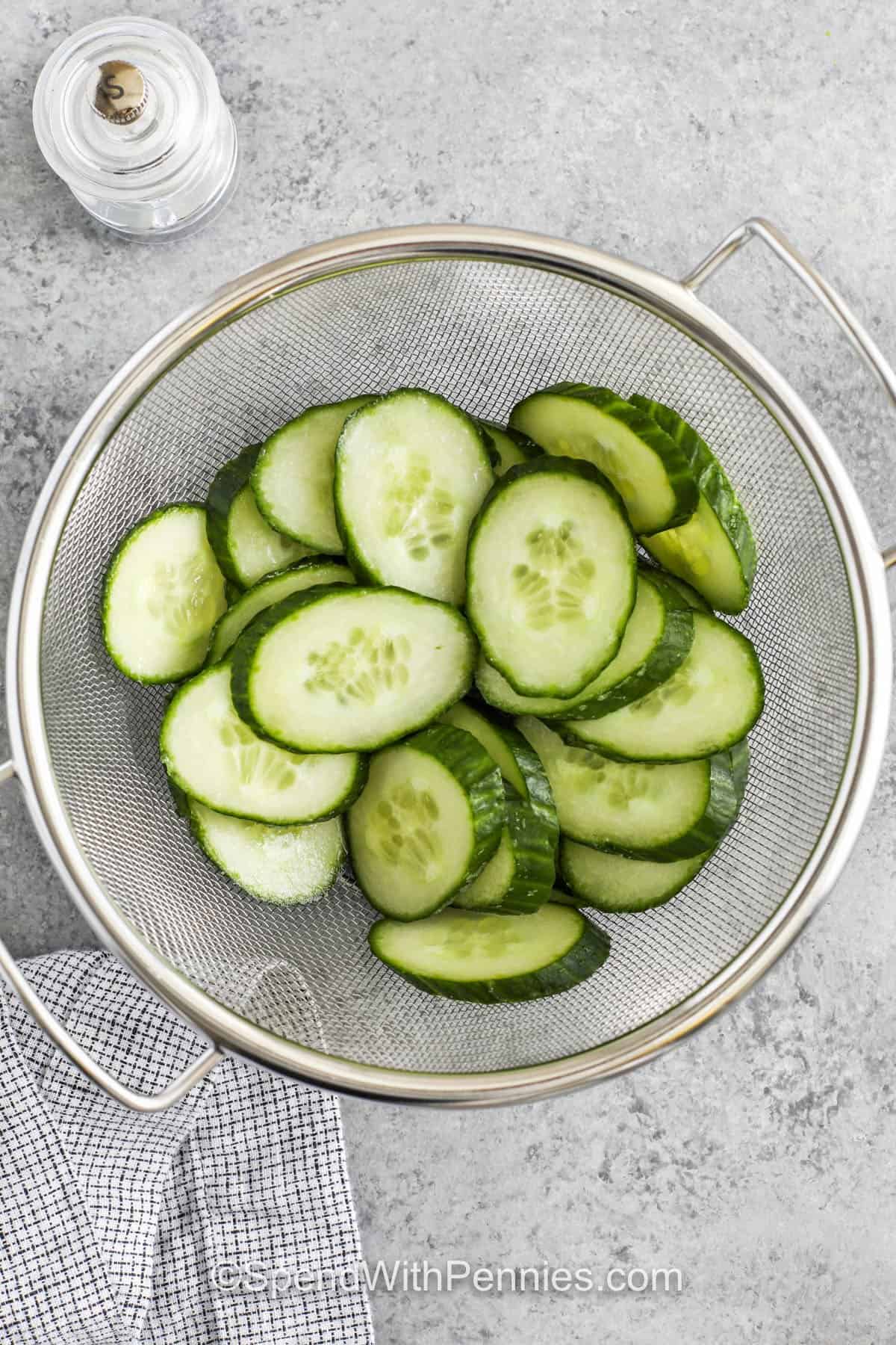 chopped cucumbers in a glass bowl