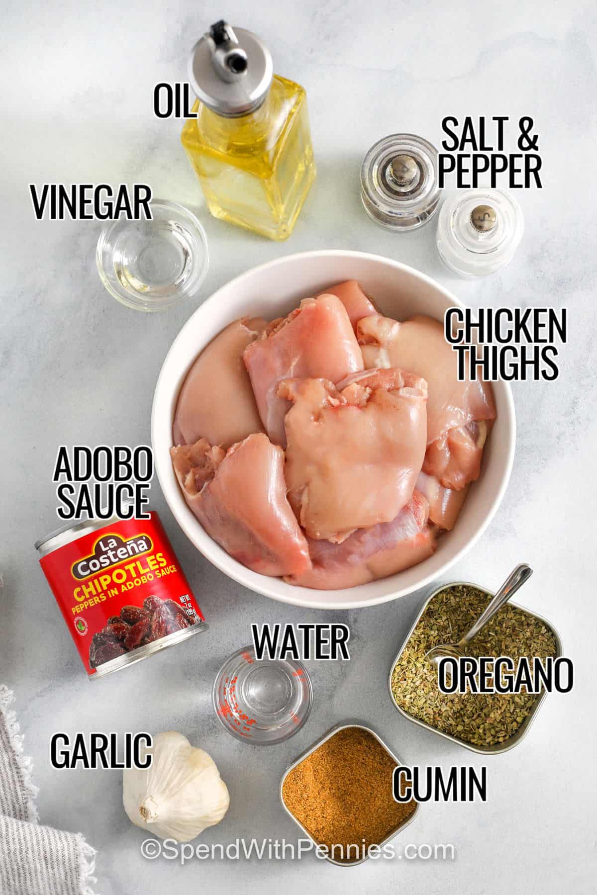 oil , vinegar , chicken thighs , adobo sauce , garlic , water , cumin, oregano,