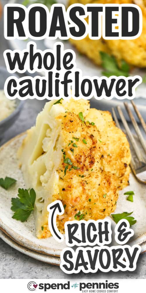 a piece of whole roasted cauliflower on a plate with a fork, with writing