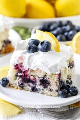 slice of Lemon Blueberry Cake with lemon slice and blueberries