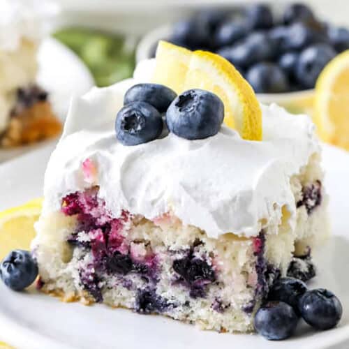slice of Lemon Blueberry Cake with lemon slice and blueberries