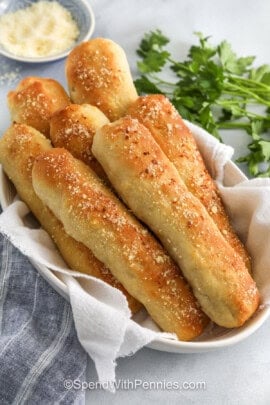 garlic and parmesan Breadsticks in a dish