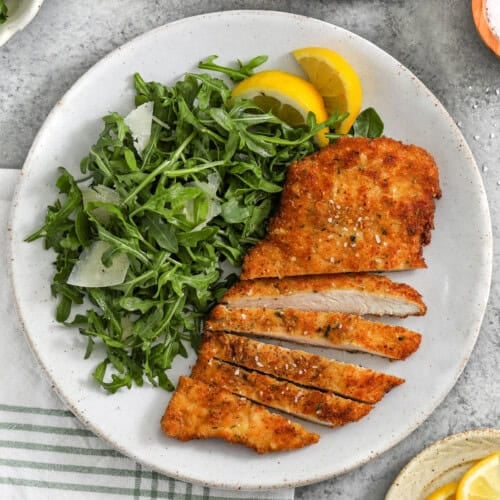 sliced Chicken Milanese with salad