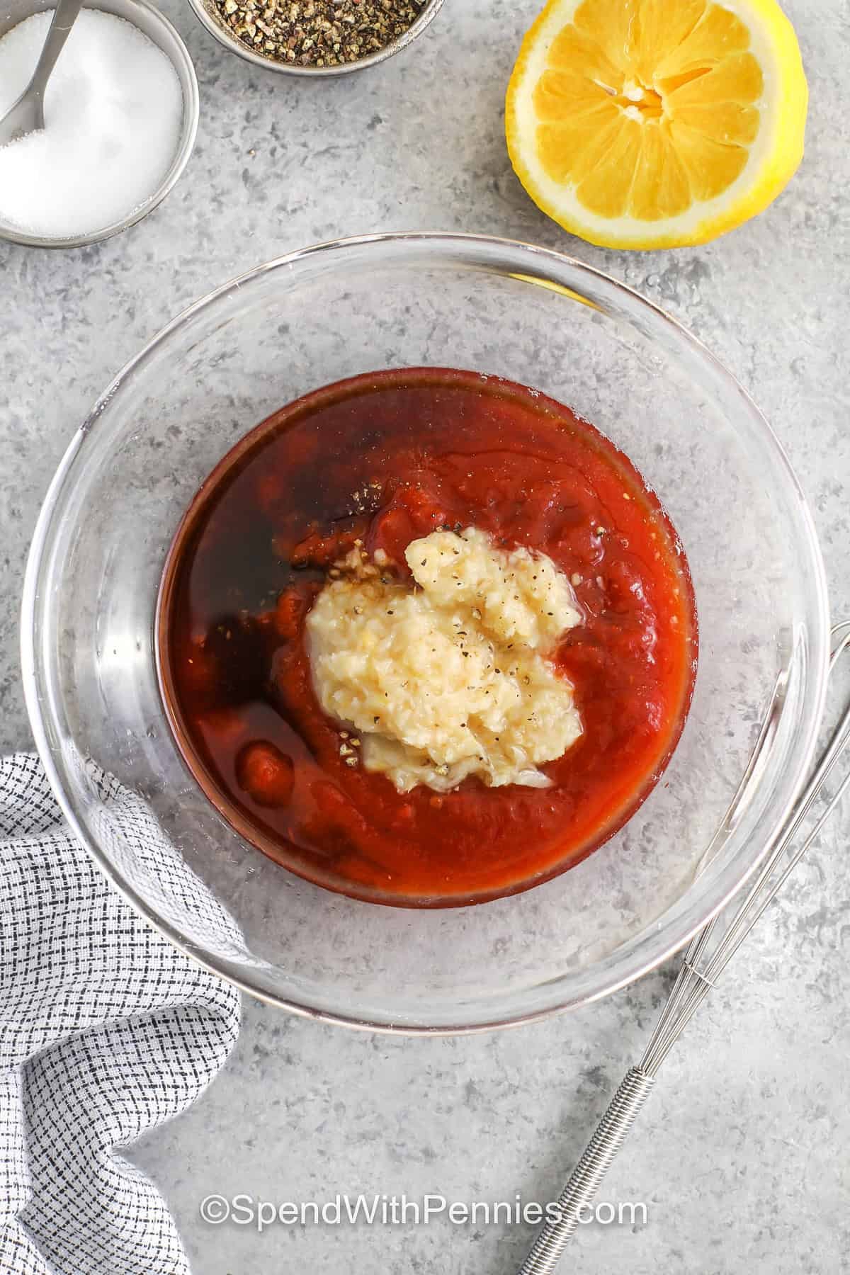 This easy cocktail sauce recipe brings classic flavor to your table with just a handful of pantry ingredients. Ketchup and prepared horseradish create a sweet and spicy combo, while lemon juice adds a zesty touch. Worcestershire sauce deepens the flavor, and a pinch of salt and pepper ties it all together. It’s ready in minutes and tastes best after a quick chill in the fridge. Perfect for dipping shrimp, crab cakes, or fried appetizers! #spendwithpennies adding ingredients to bowl to make Cocktail Sauce