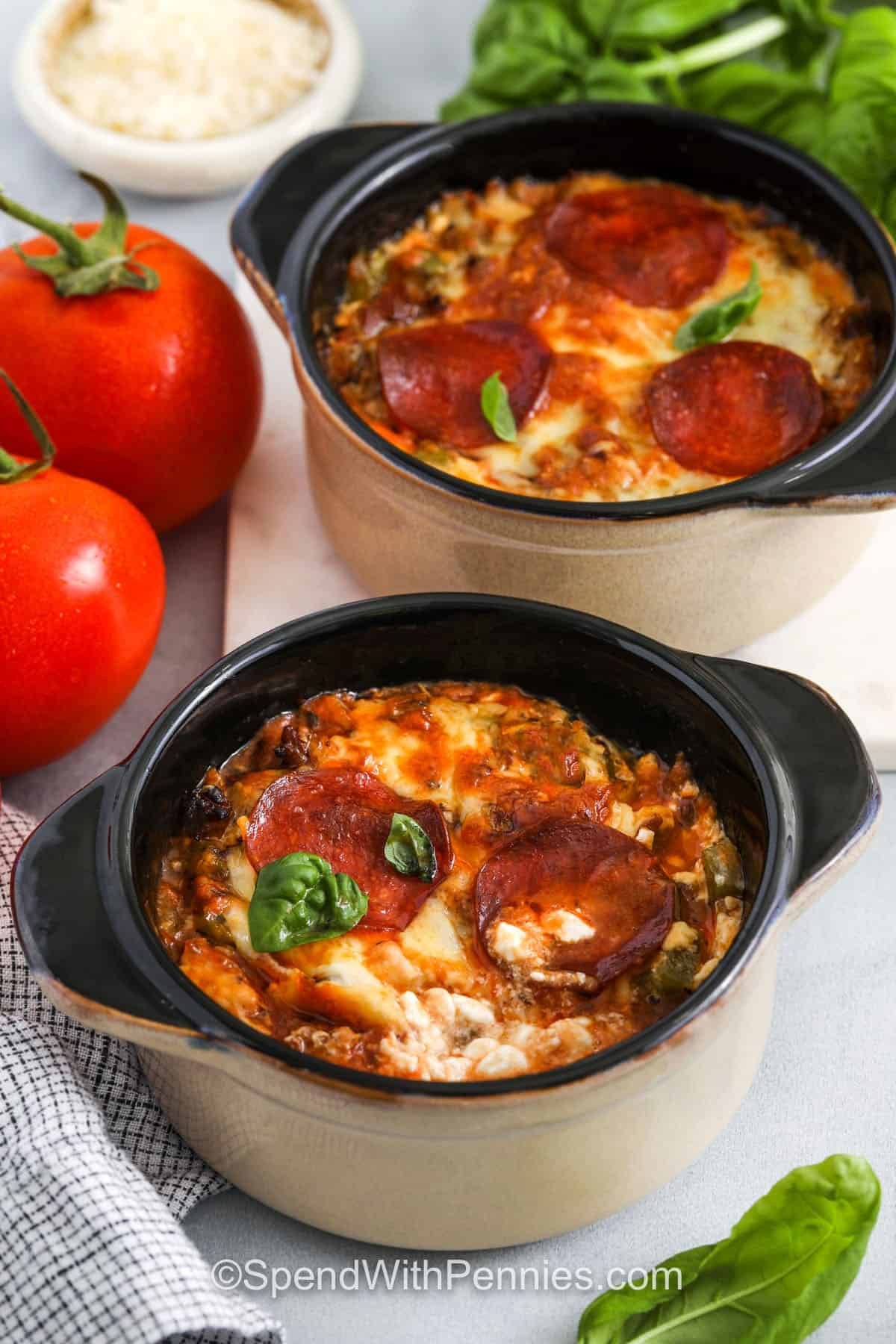 The cottage cheese pizza bowl is a delicious twist on your favorite slice—no crust needed! With browned sausage, sautéed mushrooms and peppers, and a creamy cottage cheese and egg base, this dish is hearty and flavorful. Topped with tangy sauce, melted cheese, and pepperoni, it’s everything you love in one easy bake. It’s a pizza night upgrade that couldn’t be simpler. #spendwithpennies cheesy Cottage Cheese Pizza Bowls