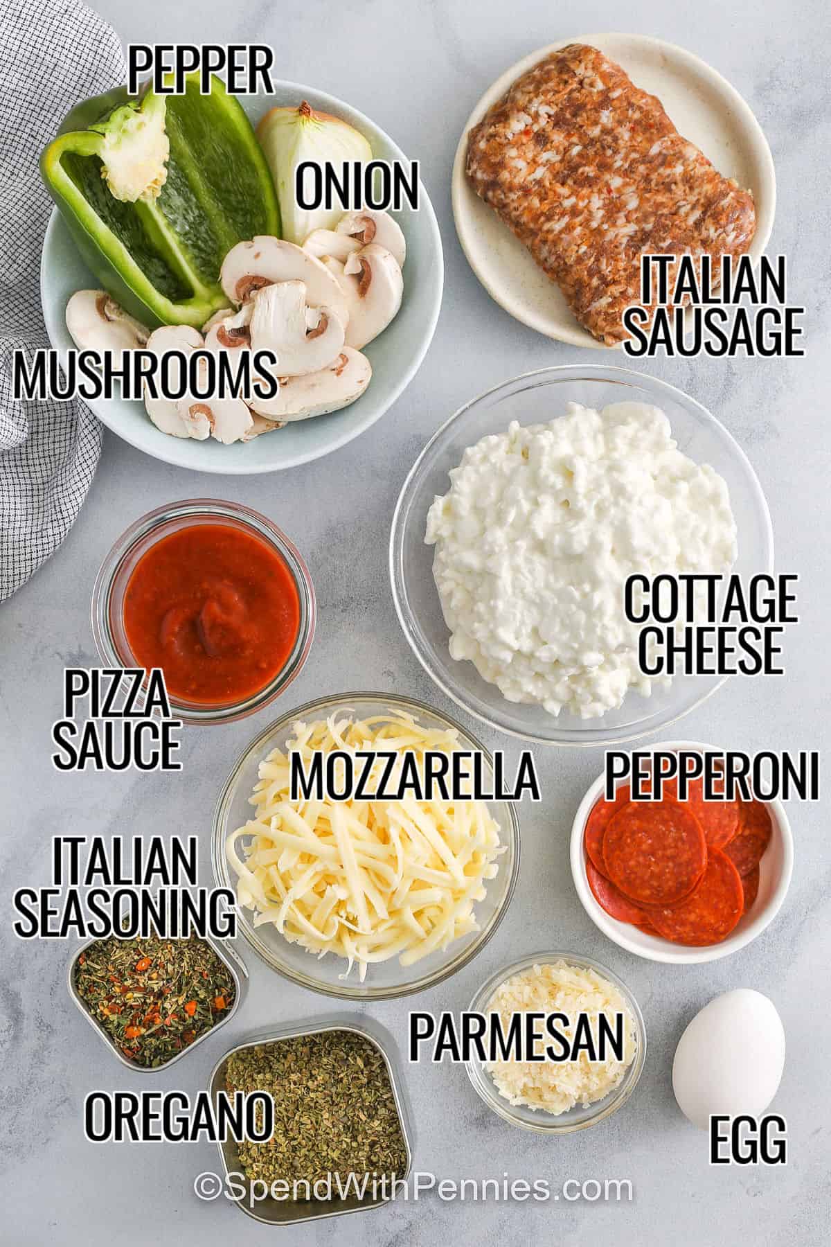 A cottage cheese pizza bowl brings big pizza flavor in a fun and easy crustless version. Sausage, mushrooms, peppers, and a touch of Italian seasoning get baked over creamy cottage cheese and rich pizza sauce. With melted cheese and crispy pepperoni on top, every spoonful is comforting and full of flavor. Perfect for those nights when you want something hearty but simple. #spendwithpennies mushrooms , pepper , onion , italian sausage , cottage cheese, pizza sauce , mozzarella , italian seasoning , oregano , parmesan , pepperoni , egg with labels to make Cottage Cheese Pizza Bowls