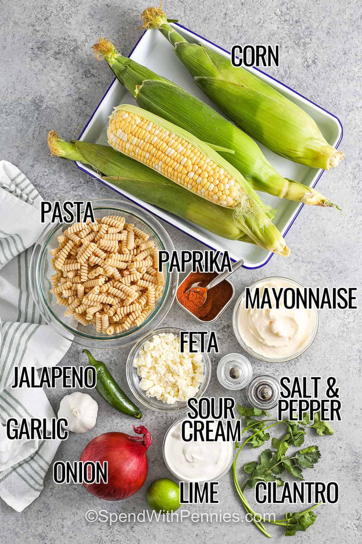corn , pasta , paprika , mayonnaise , feta , jalapeno , garlic , onion , lime , sour cream , salt and pepper , cilantro with labels to make Elote Pasta Salad