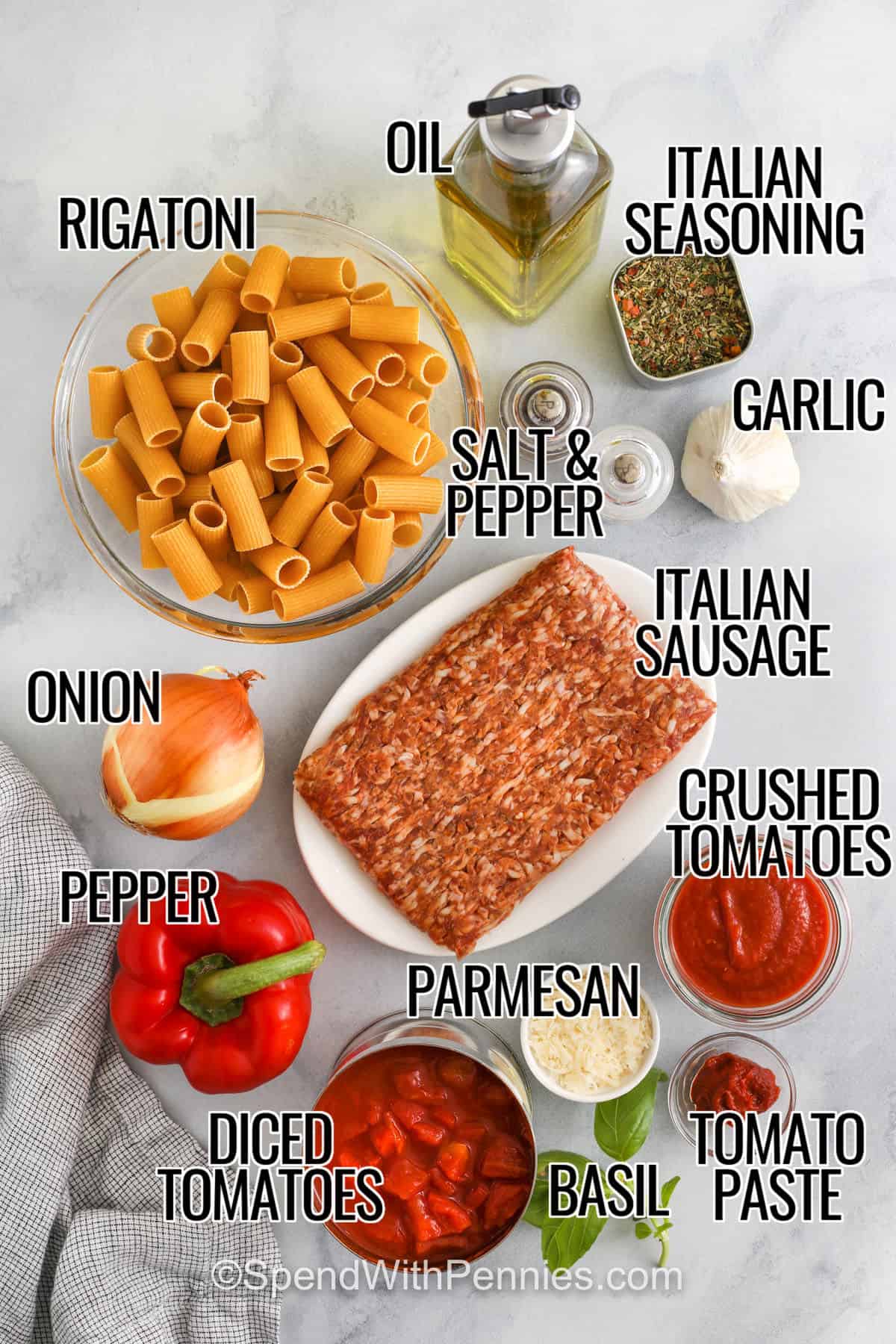 Rigatoni, oil, Italian seasoning, garlic, salt and pepper, Italian sausage, crushed tomatoes, parmesan, tomato sauce, basil, diced tomatoes, pepper, onion with labels, made into Italian sausage pasta