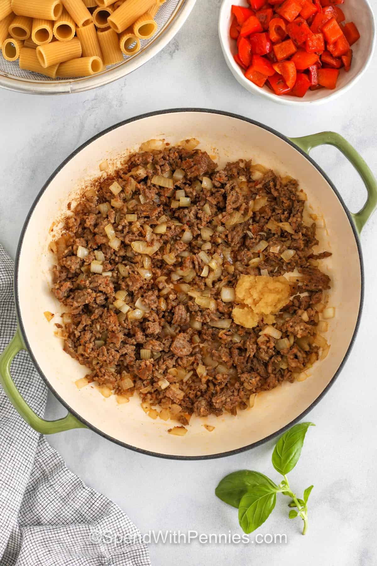 Italian sausage pasta is a recipe that is always full of flavor. The sausage gives the sauce a savory kick, while the chili and garlic stumble around. Add your favorite pasta and stir together, then add cheese and fresh basil. This is the perfect choice when you need something comfortable but don't want to overthink dinner. Everyone will ask for a few seconds. #spendwithpennies Cook the meat with onion and garlic to make the pasta with sausage