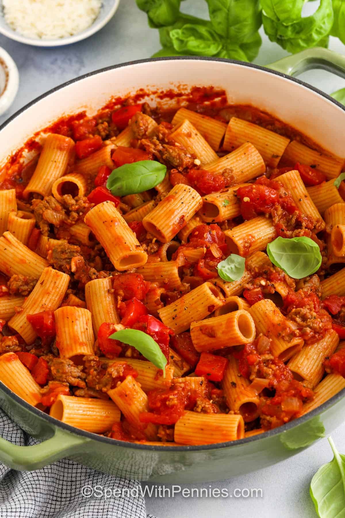 Italian sausage pasta is everything you want in a comfortable dinner. The sausage adds a bold bite, and the tomatoes and garlic bring them all together. Add pasta and your favorite toppings to make your own dish easy. Whether it's leftovers, it's a pleasant person. Do it once and this will be the regular on your menu. #spendwithpennies Italian sausage pasta with basil