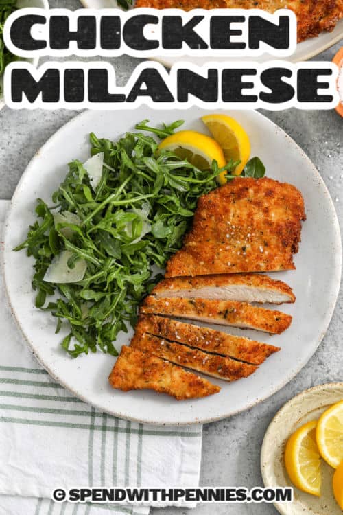 Chicken Milanese with salad and a title