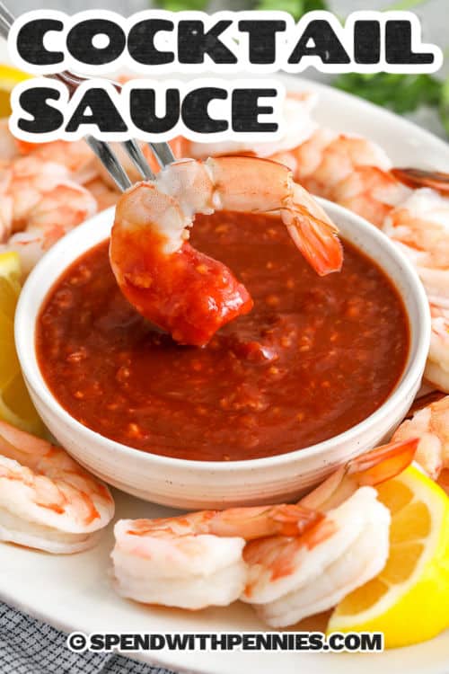This cocktail sauce recipe is a bold and tangy favorite made with just a handful of ingredients. Ketchup and horseradish bring that sweet heat, while lemon juice and Worcestershire add a fresh, savory twist. A pinch of salt and pepper rounds it out perfectly. Chill it for 30 minutes and serve with shrimp or seafood for a flavor-packed dip. #spendwithpennies Cocktail Sauce with shrimp and lemon slices with a title